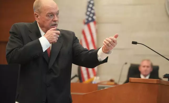 Attorney Howard Merkle, representing the state of Ohio, speaks to the jury during opening statements in the retrial of former Franklin County Deputy Jason Meade, who is charged with murder and reckless homicide in the 2020 killing of Casey Goodson Jr., inside Franklin County Common Pleas Court in Columbus, Ohio, Thursday, April 23, 2026. (Doral Chenoweth/Pool Photo via AP)
