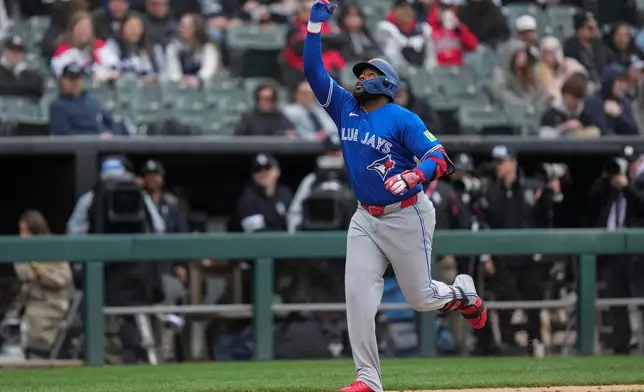 Toronto Blue Jays' Vladimir Guerrero Jr. (27) runs the bases after hitting a home run during the sixth inning of a baseball game against the Chicago White Sox, Saturday, April 4, 2026, in Chicago. (AP Photo/Erin Hooley)
