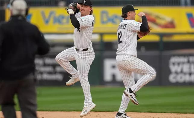 Chicago White Sox second baseman Chase Meidroth, left, and shortstop Colson Montgomery (12) celebrate their team's win over the Toronto Blue Jays following a baseball game Saturday, April 4, 2026, in Chicago. (AP Photo/Erin Hooley)