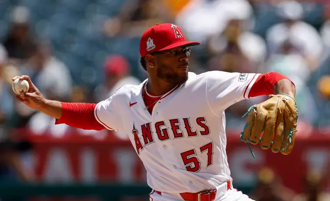 Los Angeles Angels starting pitcher Walbert Urena delivers during the first inning of a baseball game against the San Diego Padres, Sunday, April 19, 2026, in Anaheim, Calif. (AP Photo/Caroline Brehman)