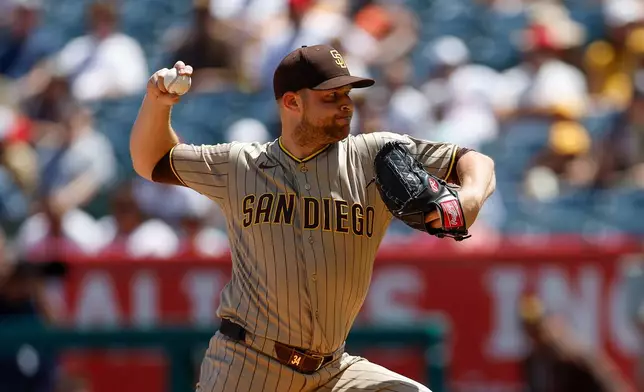 San Diego Padres starting pitcher Michael King delievers during the first inning of a baseball game against the Los Angeles Angels, Sunday, April 19, 2026, in Anaheim, Calif. (AP Photo/Caroline Brehman)
