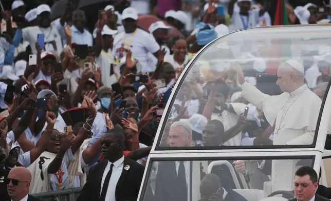 Pope Leo XIV arrives in Kilamba, some 30 kilometers south of Luanda, Angola, to preside over Sunday Mass, Sunday, April 19, 2026, on the seventh day of an 11-day apostolic journey to Africa. (AP Photo/Andrew Medichini)
