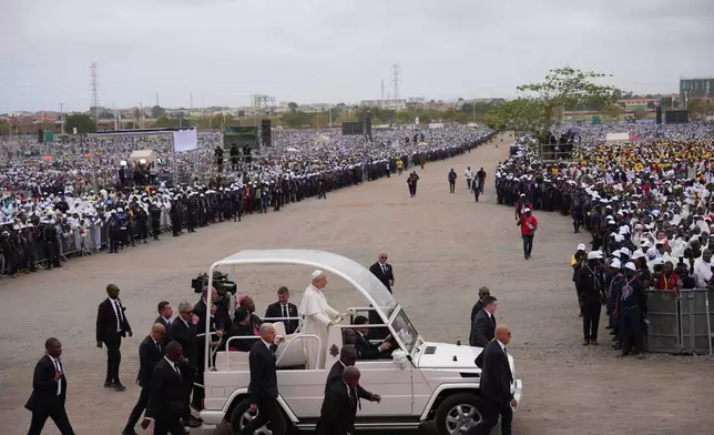Pope Leo XIV arrives in Kilamba, some 30 kilometers south of Luanda, Angola, to preside over Sunday Mass, Sunday, April 19, 2026, on the seventh day of an 11-day apostolic journey to Africa. (AP Photo/Andrew Medichini)