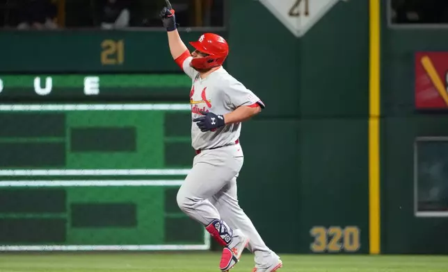 St. Louis Cardinals' Pedro Pagés celebrates as he rounds the bases on his home run off of Pittsburgh Pirates pitcher Dennis Santana in the ninth inning of a baseball game, in Pittsburgh, Monday, April 27, 2026. (AP Photo/Tom E. Puskar)