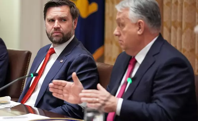 FILE - Vice President JD Vance, left, listens as Hungary's Prime Minister Viktor Orban speaks during a meeting in the Cabinet Room of the White House, Friday, Nov. 7, 2025, in Washington. (AP Photo/Evan Vucci, File)