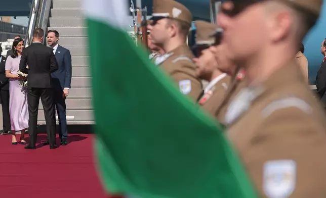 U.S. Vice President JD Vance, third left, and second lady Usha Vance arrive at Budapest Ferenc Liszt International Airport in Budapest, Hungary Tuesday, April 7, 2026. (Jonathan Ernst/Pool Photo via AP)