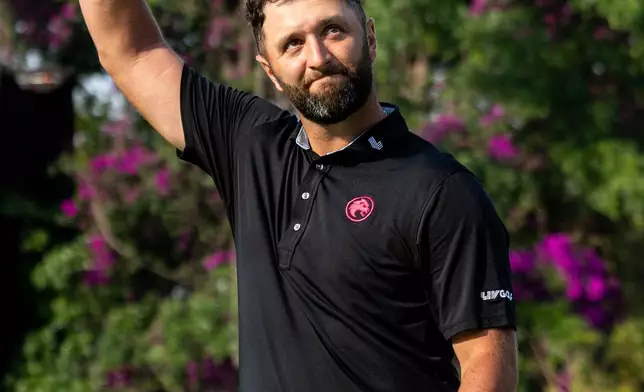 First-place individual champion captain Jon Rahm, of Legion XIII, celebrates on the 18th green after the final round of LIV Golf Mexico City at Club de Golf Chapultepec, Sunday, April 19, 2026, in Naucalpan, Mexico. (Charles Laberge/LIV Golf via AP)