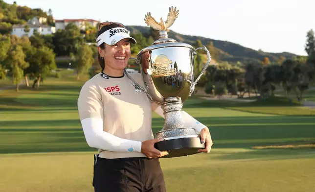 Hannah Green poses with the trophy after winning the LPGA JM Eagle LA Championship golf tournament at El Caballero Country Club Sunday, April 19, 2026, in Los Angeles. (AP Photo/Jessie Alcheh)