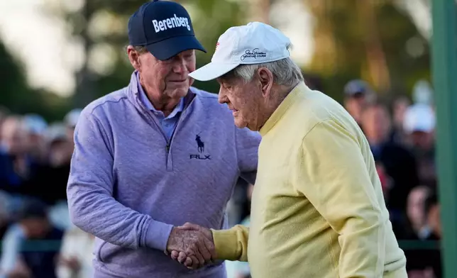 Jack Nicklaus is greeted by Tom Watson during the ceremonial tee shot on the first hole during the first round of the Masters golf tournament at the Augusta National Golf Club, Thursday, April 9, 2026, in Augusta, Ga. (AP Photo/Eric Gay)
