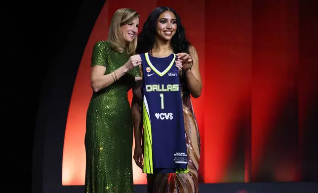 UConn guard Azzi Fudd poses with WNBA commissioner Cathy Engelbert after being selected first overall by the Dallas Wings in the first round of the WNBA basketball draft Monday, April 13, 2026, in New York. (AP Photo/Pamela Smith)