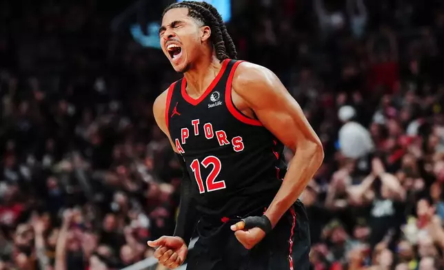Toronto Raptors' Collin Murray-Boyles (12) celebrates a basket against the Cleveland Cavaliers during the second half of an NBA playoff basketball game in Toronto on Thursday, April 23, 2026. (Frank Gunn/The Canadian Press via AP)