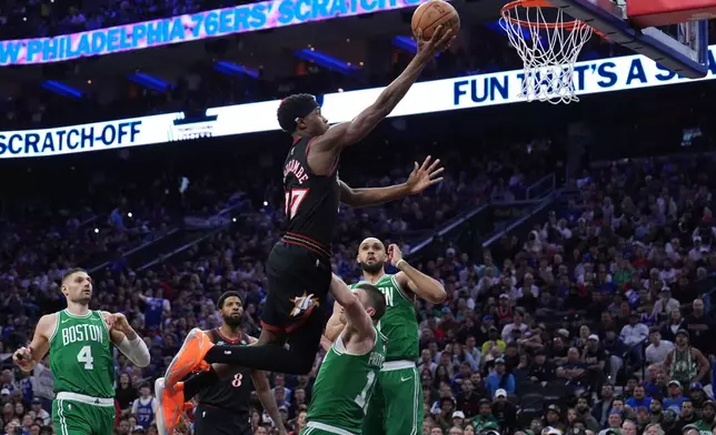 Philadelphia 76ers' VJ Edgecombe (77) goes up for a shot against Boston Celtics' Payton Pritchard (11) during the second half of Game 3 in a first-round NBA playoffs basketball series Friday, April 24, 2026, in Philadelphia. (AP Photo/Matt Slocum)