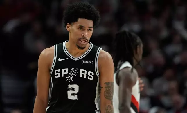 San Antonio Spurs guard Dylan Harper (2) reacts to a play during the second half in Game 3 of a first-round NBA playoffs basketball series against the Portland Trail Blazers in Portland, Ore, Friday, April 24, 2026. (AP Photo/Jenny Kane)