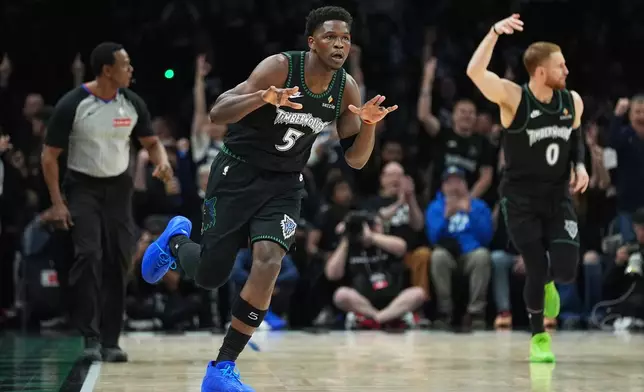 Minnesota Timberwolves guard Anthony Edwards (5) celebrates after making a 3-point shot during the first half of Game 4 of a first-round NBA basketball playoff series against the Denver Nuggets, Saturday, April 25, 2026, in Minneapolis. (AP Photo/Abbie Parr)