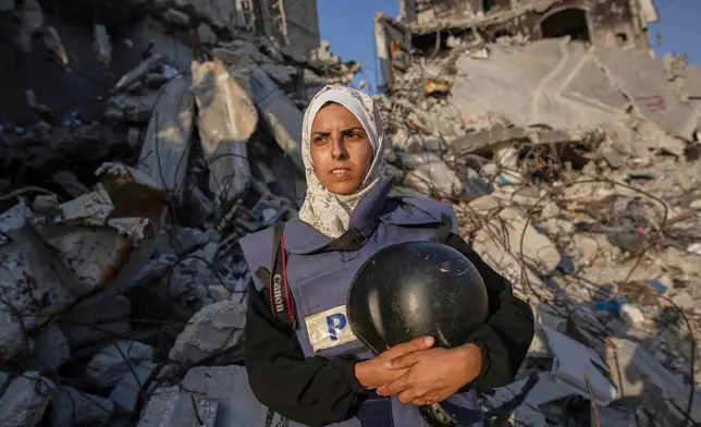 FILE - Freelance journalist Mariam Dagga, 33, who had been working with the Associated Press and other outlets during the Gaza war, poses for a portrait in Khan Younis, southern Gaza Strip, on June 14, 2024. (AP Photo/Jehad Alshrafi, File)