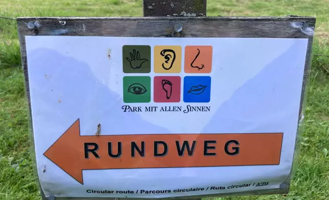 A sign at the Park for All Senses, known locally as Park Mit Allen Sinnen, is displayed, Thursday, Aug. 8, 2024, in Gutach, Germany. (AP Photo/Kelvin Chan)