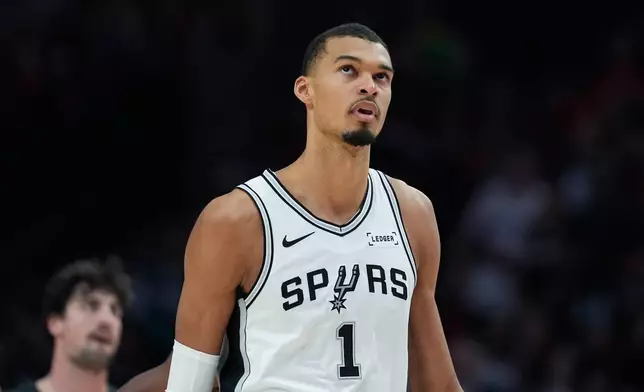 San Antonio Spurs forward/center Victor Wembanyama looks during the first half in Game 4 of a first-round NBA basketball playoffs series against the Portland Trail Blazers, in Portland, Ore., Sunday, April 26, 2026. (AP Photo/Jenny Kane)