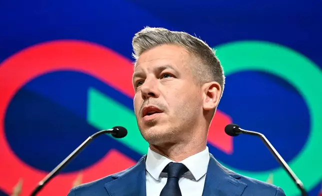 Peter Magyar speaks to the media in Budapest, Hungary, Monday, April 13, 2026, after defeating Prime Minister Viktor Orban's party in the country's parliamentary elections. (AP Photo/Denes Erdos)