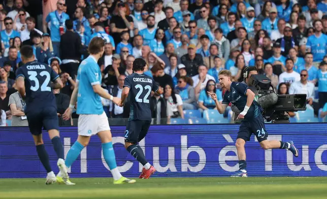 Lazio's Matteo Cancellieri, right, celebrates after scoring during the Italian Serie A soccer match between Napoli and Lazio in Naples, Italy, Saturday, April 18, 2026. (Alessandro Garofalo/LaPresse via AP)