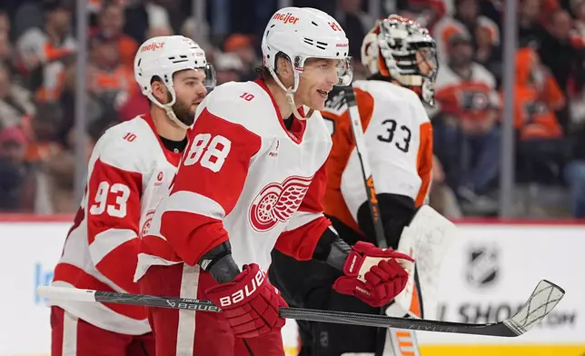 Detroit Red Wings' Patrick Kane (88) reacts after he scored past Philadelphia Flyers goaltender Samuel Ersson (33) during the third period of an NHL hockey game, Thursday, April 2, 2026, in Philadelphia. (AP Photo/Matt Rourke)