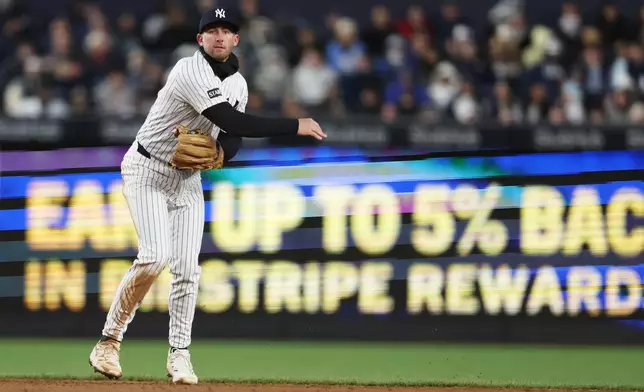 New York Yankees' Ryan McMahon throws to first for an out during the third inning of a baseball game against the Athletics, Wednesday, April 8, 2026, in New York. (AP Photo/Heather Khalifa)