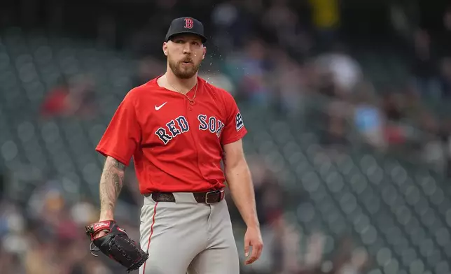 Boston Red Sox starting pitcher Garrett Crochet (35) stands in the mound as Minnesota Twins' Ryan Kreidler (5) runs the bases after hitting a solo home run during the second inning of a baseball game Monday, April 13, 2026, in Minneapolis. (AP Photo/Abbie Parr)