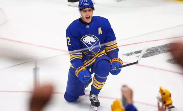 Buffalo Sabres center Tage Thompson (72) celebrates his goal during the third period in Game 1 of a first-round NHL hockey Stanley Cup playoff series against the Boston Bruins, Sunday, April 19, 2026, in Buffalo, N.Y. (AP Photo/Jeffrey T. Barnes)