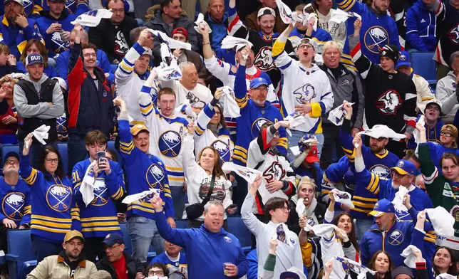 Buffalo Sabres fans celebrate during the third period in Game 1 of a first-round NHL hockey Stanley Cup playoff series against the Boston Bruins, Sunday, April 19, 2026, in Buffalo, N.Y. (AP Photo/Jeffrey T. Barnes)
