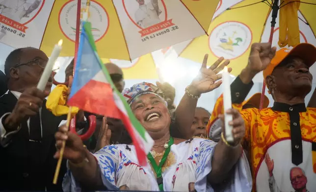Faithful cheer for Pope Leo XIV during his meeting with young people and families at the stadium in Bata, Equatorial Guinea, Wednesday, April 22, 2026. (AP Photo/Andrew Medichini)