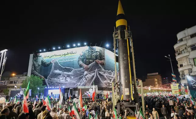 A ballistic missile is displayed by Iran's Revolutionary Guard during a pro-government demonstration at Enqelab-e-Eslami (Islamic Revolution) Square in downtown Tehran, Iran, Tuesday, April 21, 2026. (Alireza Masoumi/ISNA via AP)