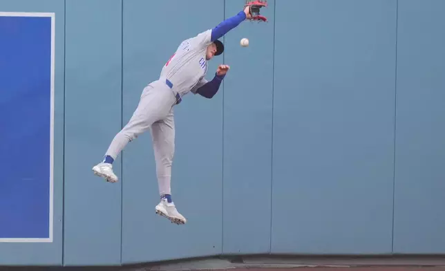 Chicago Cubs center fielder Pete Crow-Armstrong can't get to a ball hit for a double by Los Angeles Dodgers' Alex Freeland during the fifth inning of a baseball game Saturday, April 25, 2026, in Los Angeles. (AP Photo/Mark J. Terrill)