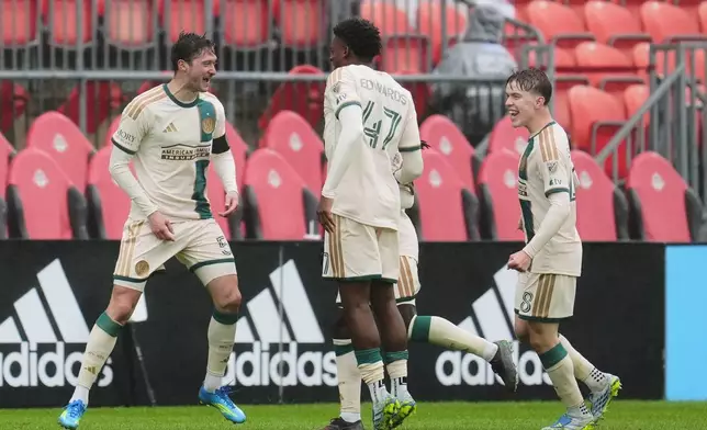 Atlanta United's Alexey Miranchuk, left, celebrates with teammates after scoring a goal against Toronto FC during the second half of an MLS soccer game in Toronto, Saturday, April 25, 2026. (Frank Gunn/The Canadian Press via AP)
