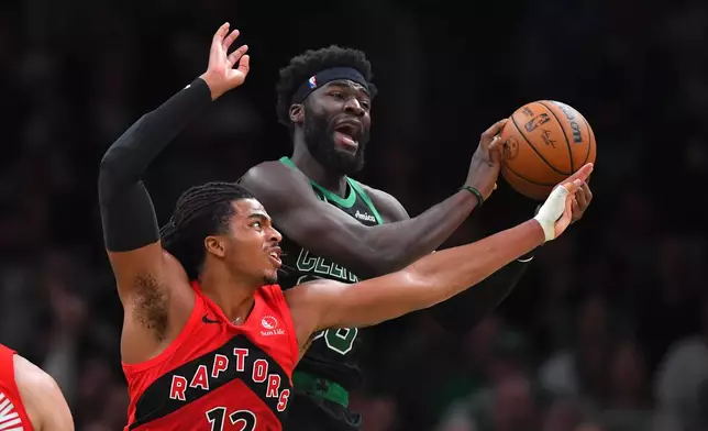 Toronto Raptors forward Collin Murray-Boyles, left, and Boston Celtics center Neemias Queta vie for control of the ball in the first half of an NBA basketball game, Sunday, April 5, 2026, in Boston. (AP Photo/Steven Senne)