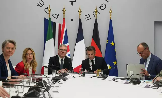 From left, Britain's Foreign Secretary Yvette Cooper, Italian Premier Giorgia Meloni, Britain's Prime Minister Keir Starmer, France's President Emmanuel Macron and German Chancellor Friedrich Merz attend an international summit to push forward efforts to reopen the Strait of Hormuz, at the Elysee Palace, in Paris, France, Friday, April 17, 2026. (AP Photo/Michel Euler, Pool)