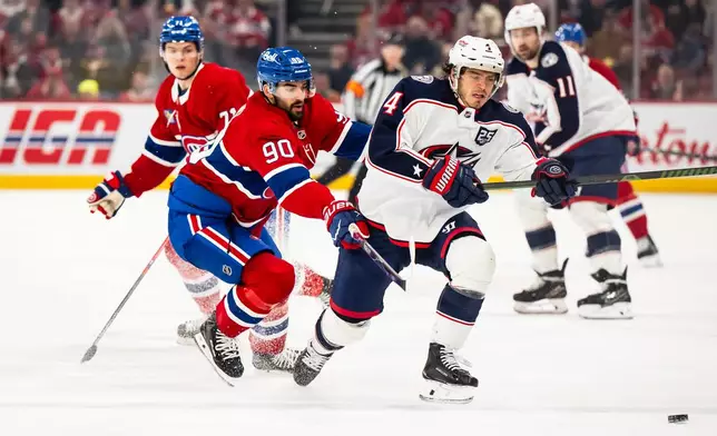 Columbus Blue Jackets' Cole Sillinger (4) and Montreal Canadiens' Joe Veleno (90) vie for the puck during first-period NHL hockey game action in Montreal, Saturday, April 11, 2026. (Christopher Katsarov/The Canadian Press via AP