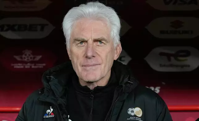 FILE - South Africa's head coach Hugo Broos watches from the bench during the Africa Cup of Nations round of 16 soccer match between South Africa and Cameroon in Rabat, Morocco, Sunday, Jan. 4, 2026. (AP Photo/Themba Hadebe, File)