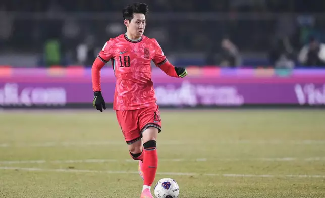 FILE - South Korea's Lee Kang-in dribbles during a World Cup qualifying soccer match against Oman in Goyang, South Korea, Thursday, March 20, 2025. (AP Photo/Lee Jin-man, File)