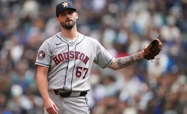Houston Astros starting pitcher Cody Bolton reacts after walking Seattle Mariners' Cole Young to load the bases during the second inning of a baseball game, Sunday, April 12, 2026, in Seattle. (AP Photo/Lindsey Wasson)