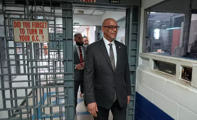 Stanley Richards, NYC Department of Correction commissioner, walks through security in the building where he was previously incarcerated on Rikers Island in New York, Tuesday, April 14, 2026. (AP Photo/Seth Wenig)