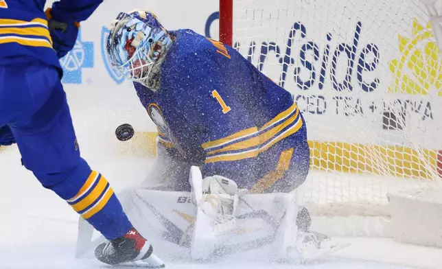 Buffalo Sabres goaltender Ukko-Pekka Luukkonen (1) makes a save in traffic during the second period of an NHL hockey game against the New York Islanders Tuesday, March 31, 2026, in Buffalo, N.Y. (AP Photo/Jeffrey T. Barnes)