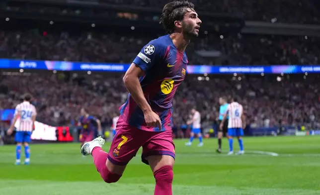 Barcelona's Ferran Torres celebrates after scoring his side's second goal the Champions League quarterfinal second leg soccer match between Atletico Madrid and Barcelona in Madrid, Spain, Tuesday, April 14, 2026. (AP Photo/Manu Fernandez)