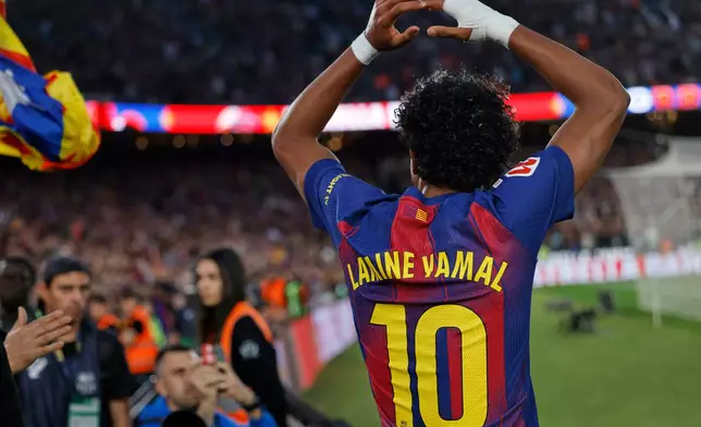 Barcelona's Lamine Yamal celebrates during the Spanish La Liga soccer match between Barcelona and Espanyol in Barcelona, Spain, Saturday, April 11, 2026. (AP Photo/Joan Monfort)