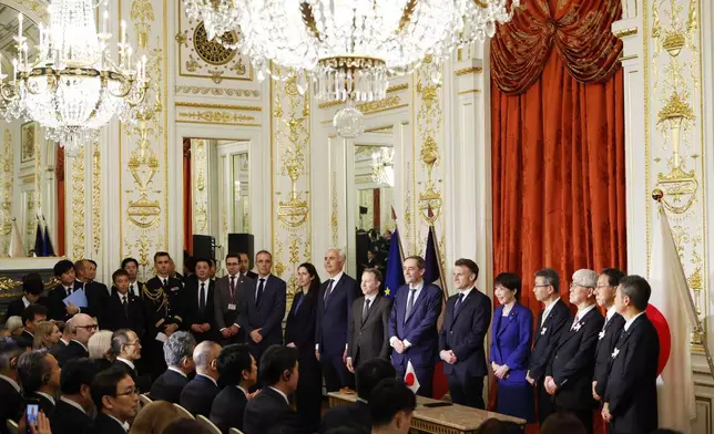 Japanese Prime Minister Sanae Takaichi, center right, and French President Emmanuel Macron, center left, pose for a group photo during signing ceremony at the Akasaka Palace state guest house in Tokyo Wednesday, April 1, 2026. (Franck Robichon/Pool Photo via AP)