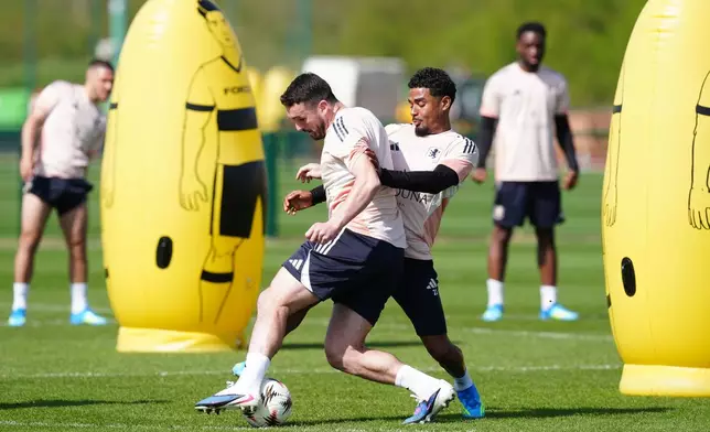 Aston Villa's John McGinn and Ian Maatsen during a training session at Bodymoor Heath Training Ground, Tamworth, England, Wednesday April 8, 2026. (David Davies/PA via AP)
