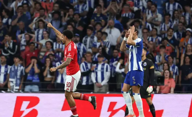 Nottingham Forest's Morgan Gibbs-White, left, celebrates his side's first goal during the Europa League quarterfinals, first leg, soccer match between FC Porto and Nottingham Forest in Porto, Portugal, Thursday, April 9, 2026. (AP Photo/Luis Vieira)
