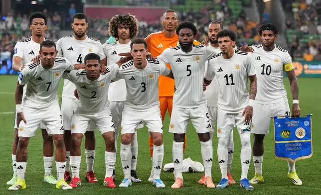 Curacao pose for a team photo ahead of their international soccer friendly against Australia in Melbourne, Australia, Tuesday, March 31, 2026. (AP Photo/Asanka Brendon Ratnayake)