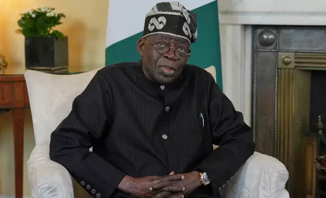 FILE - President of Nigeria Bola Ahmed Tinubu speaks to the media ahead of his meeting with Britain's Prime Minister Keir Starmer inside 10 Downing Street in London, Thursday, March 19, 2026. (AP Photo/Kin Cheung, Pool File)