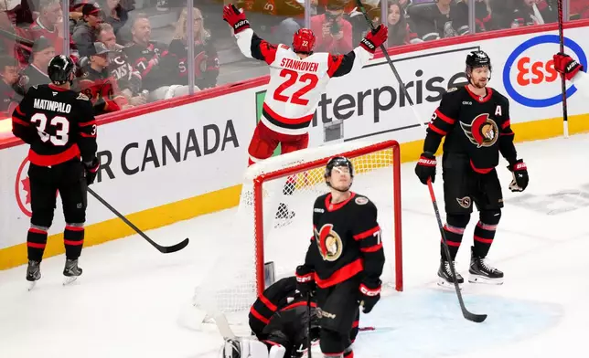 Carolina Hurricanes centre Logan Stankoven (22) celebrates his goal past Ottawa Senators goaltender Linus Ullmark (35) during the third period in Game 4 of a first-round NHL Stanley Cup playoff hockey series, Saturday, April 25, 2026, in Ottawa, Ontario. (Sean Kilpatrick/The Canadian Press via AP)