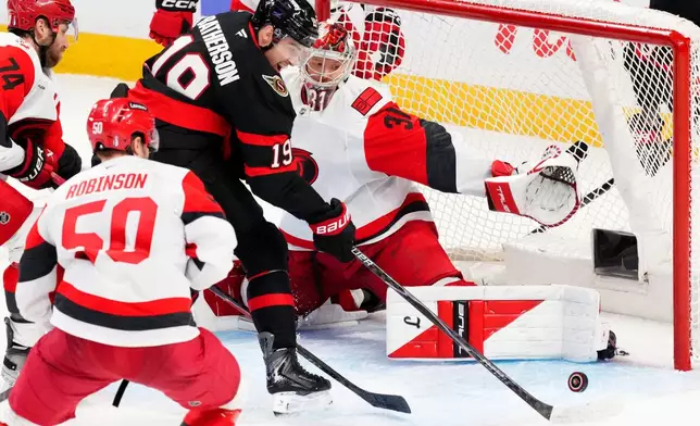 Ottawa Senators right wing Drake Batherson (19) fails to get the puck past Carolina Hurricanes goaltender Frederik Andersen (31) during the third period of Game 4 in a first-round NHL hockey Stanley Cup playoff series in Ottawa, Ontario, Saturday, April 25, 2026. (Sean Kilpatrick/The Canadian Press via AP)