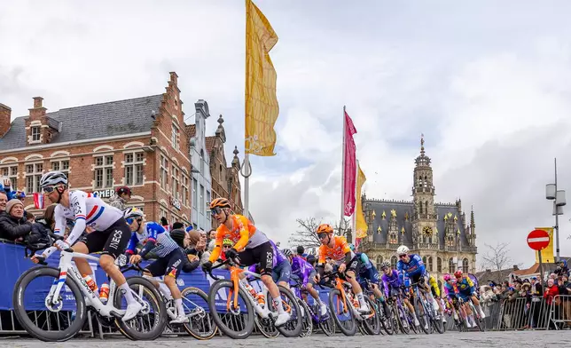 The pack of riders compete during the Tour of Flanders in Oudenaarde, Belgium on Sunday, April 5, 2026. (AP Photo/Geert Vanden Wijngaert)